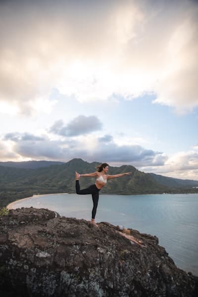 Morning yoga on rock in nature
